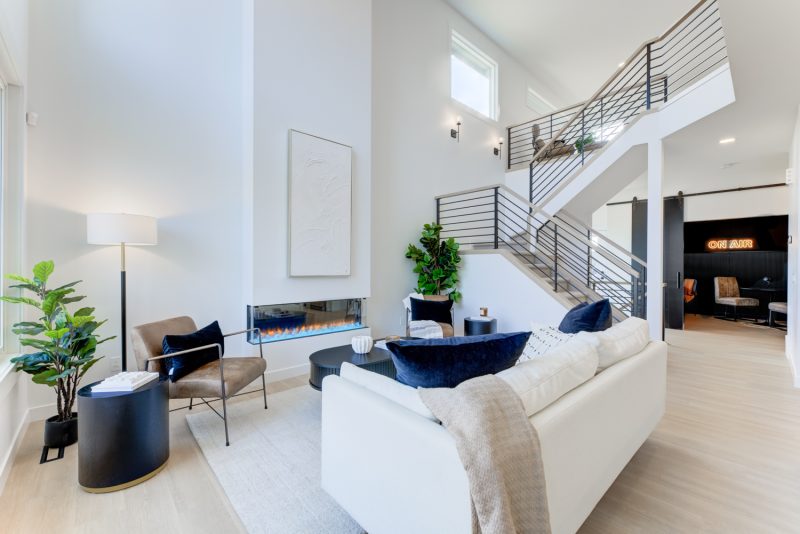 Living Room with electric fireplace of City Home’s Brantford Showhome in Kinglet by Big Lake