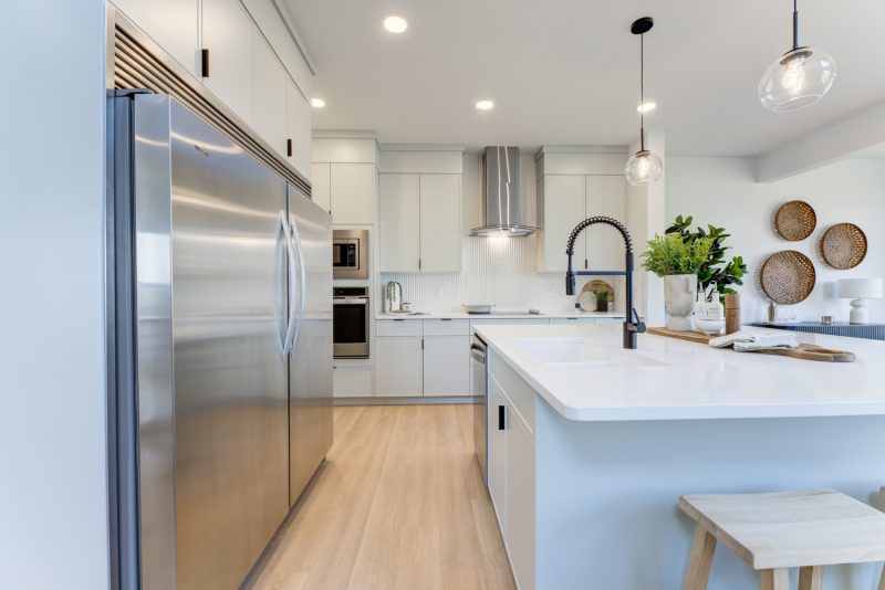 Kitchen with oversized fridge of City Home’s Brantford Showhome in Kinglet by Big Lake