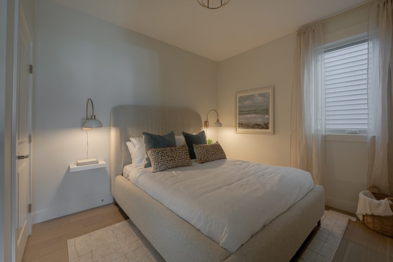 Main floor bedroom in Anthem's front drive 120 showhome in Kinglet by Big Lake